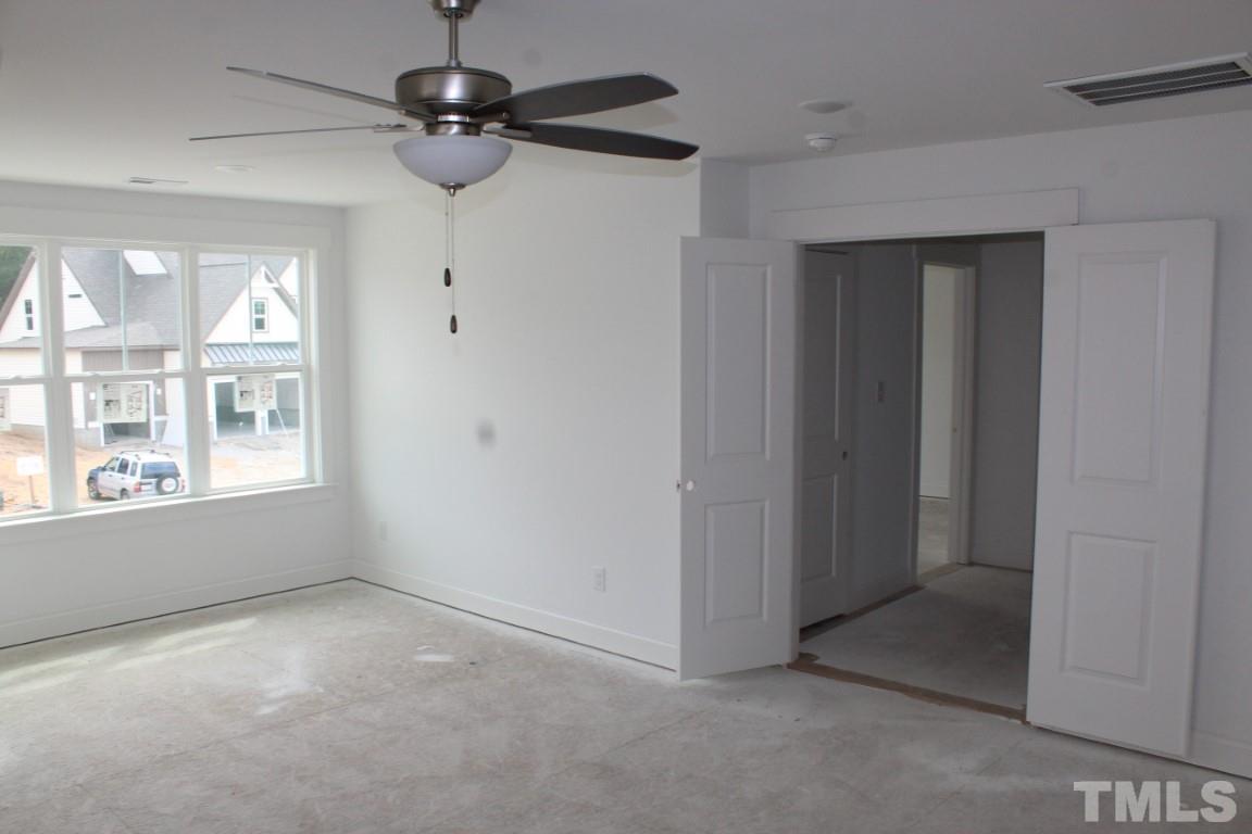 328 Prides Crossing Rolesville, NC 27571 - Photo 20 of 23 a view of an empty room with a window