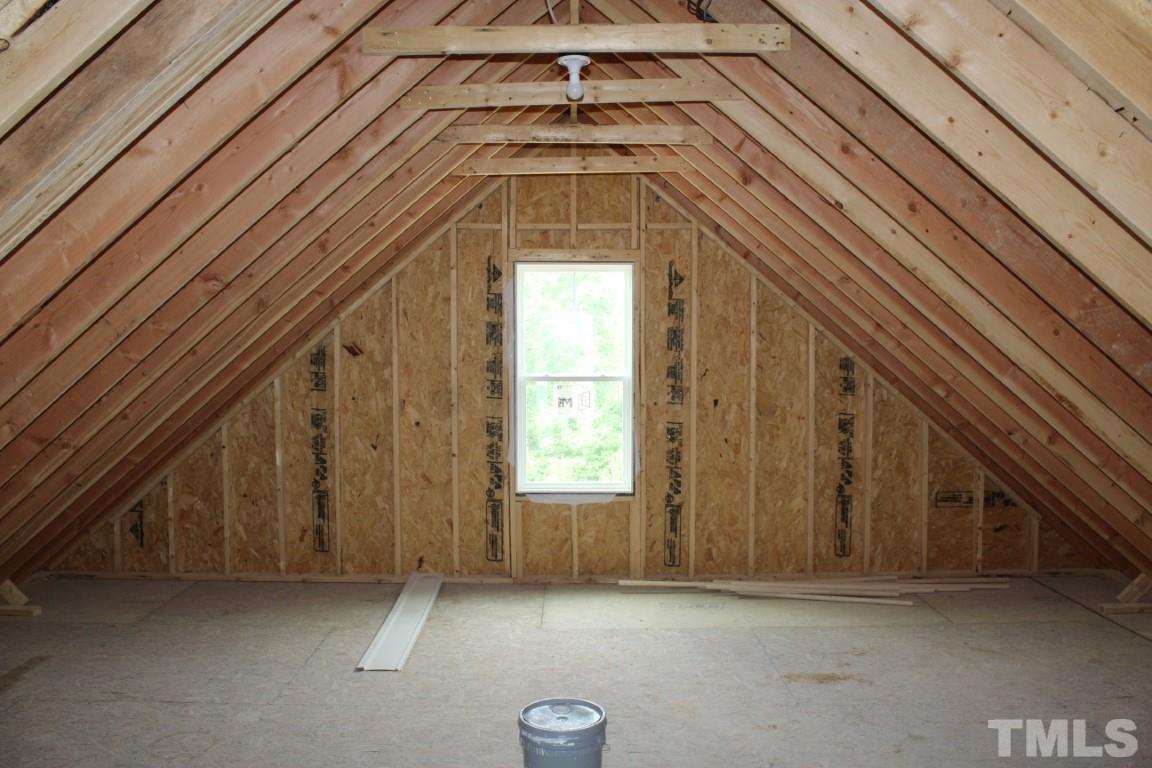 328 Prides Crossing Rolesville, NC 27571 - Photo 22 of 23 a view of a hallway with a chandelier