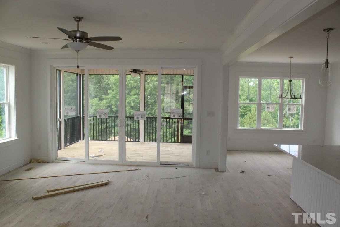 328 Prides Crossing Rolesville, NC 27571 - Photo 6 of 23 a view of an empty room with a balcony