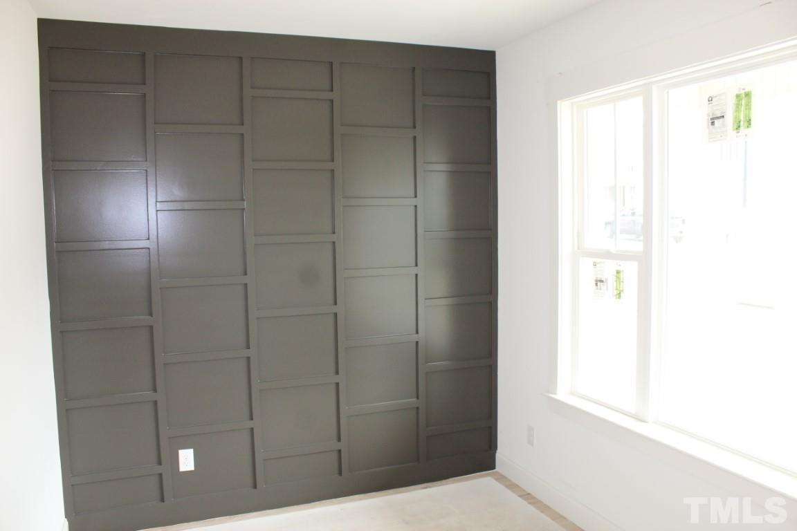 328 Prides Crossing Rolesville, NC 27571 - Photo 7 of 23 a bathroom with a shower and a glass door