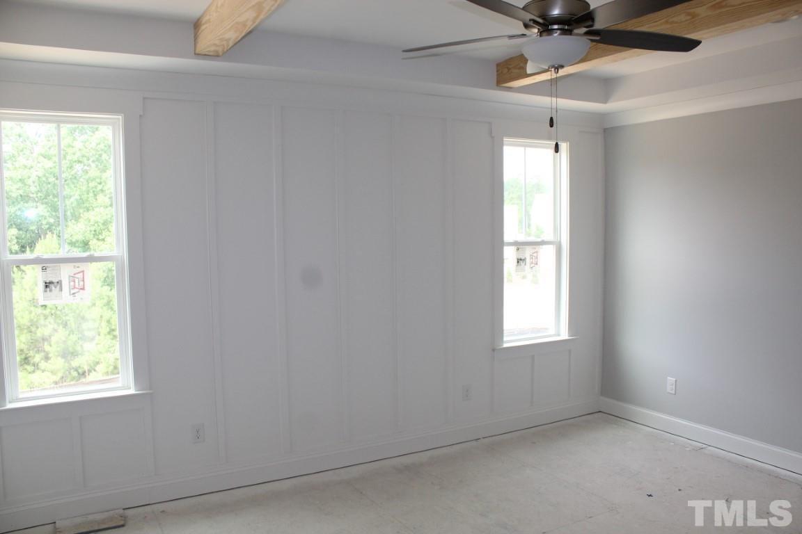 328 Prides Crossing Rolesville, NC 27571 - Photo 9 of 23 an empty room with a window and a fan
