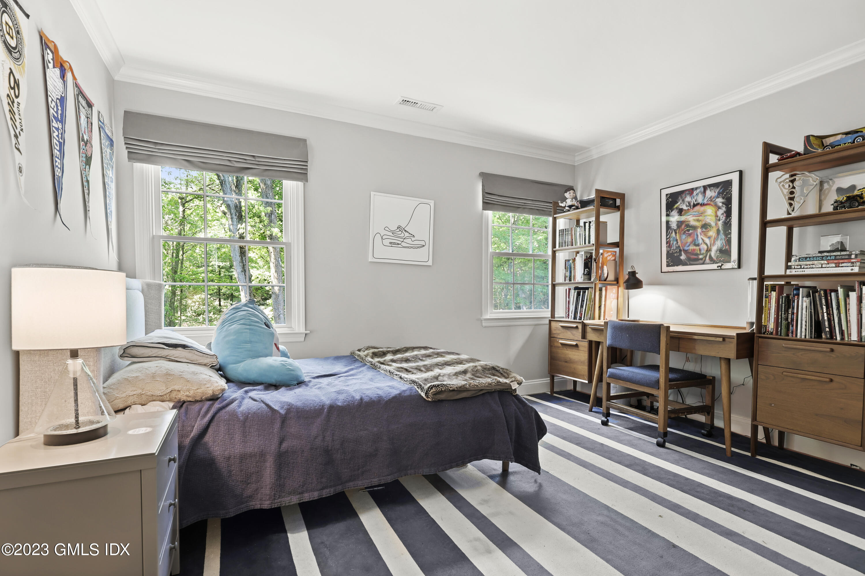 7 Cottontail Road Cos Cob, CT 06807 - Photo 17 of 29 a bedroom with a bed and a book shelf