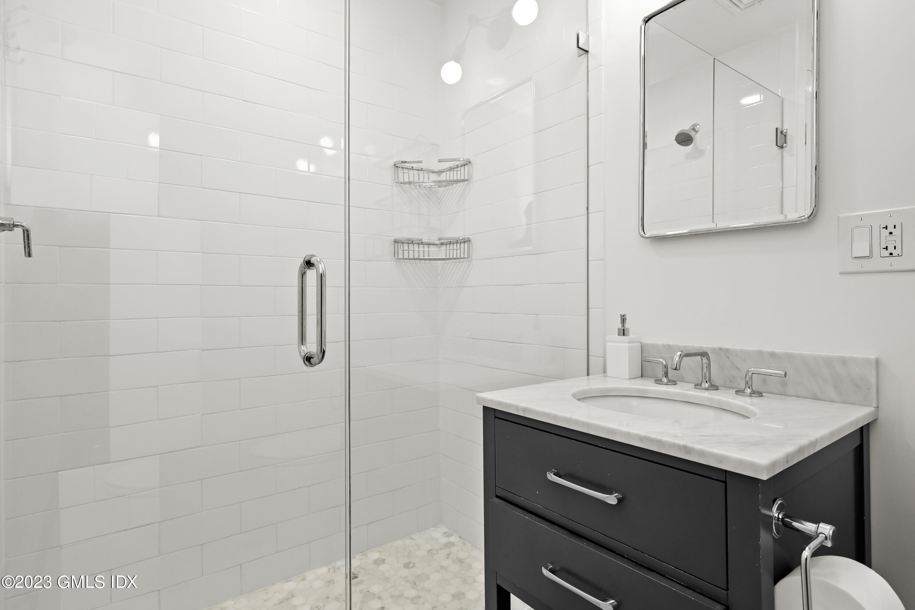 7 Cottontail Road Cos Cob, CT 06807 - Photo 18 of 29 a bathroom with a sink double vanity and a shower