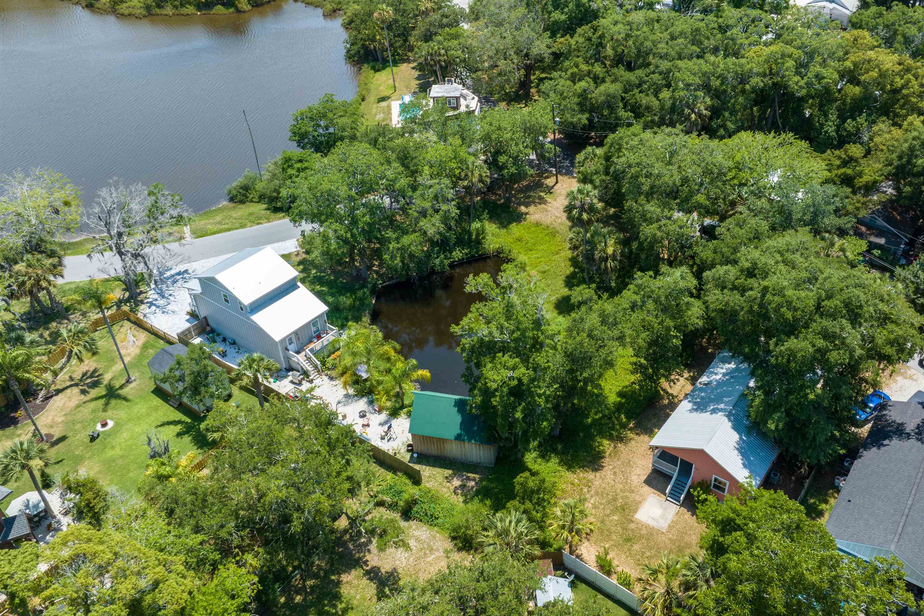 25 Davis Street St. Augustine, FL 32084 - Photo 5 of 13 an aerial view of a house with a yard and lake view