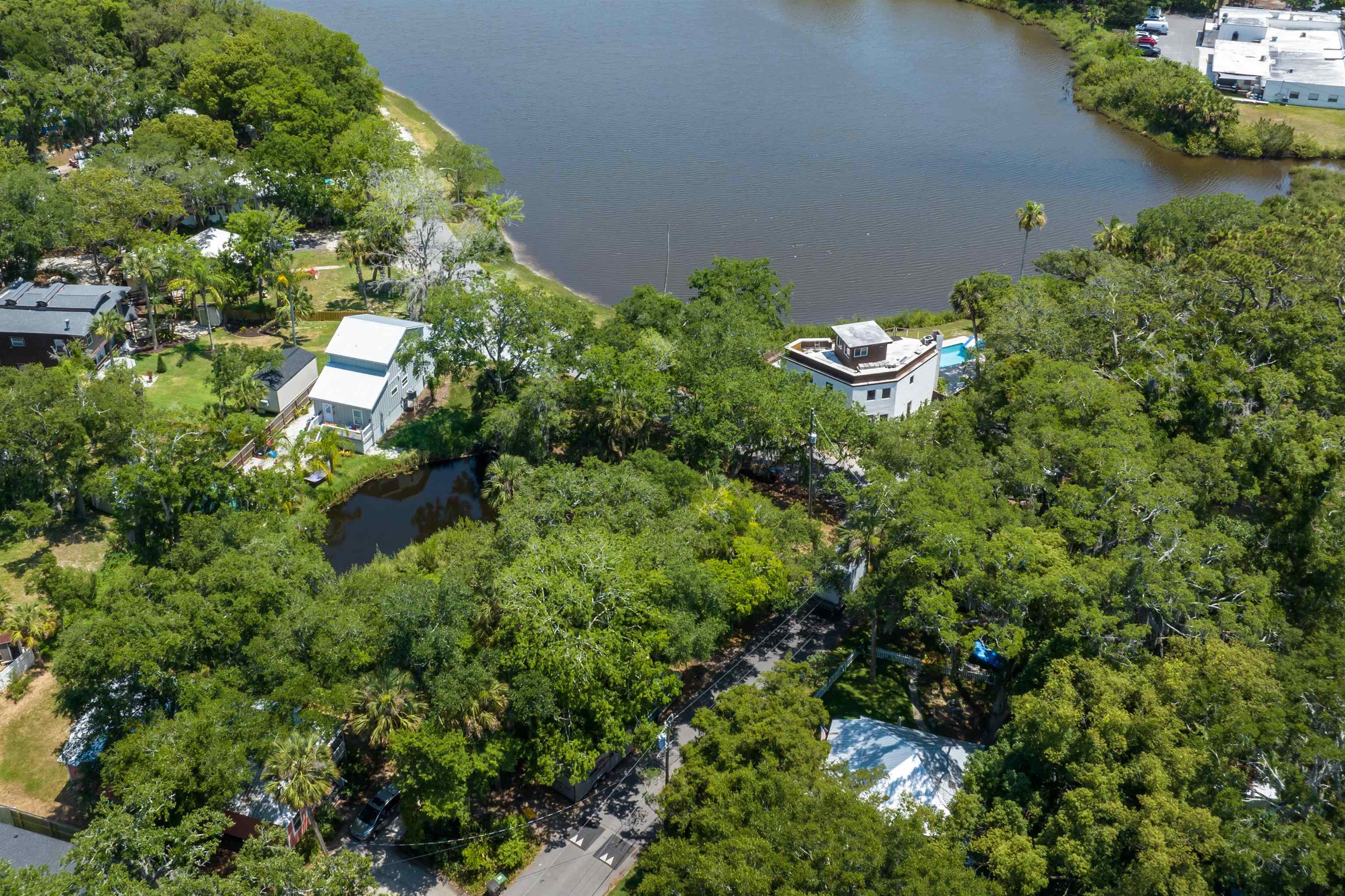 25 Davis Street St. Augustine, FL 32084 - Photo 8 of 13 an aerial view of a house with a yard and garden