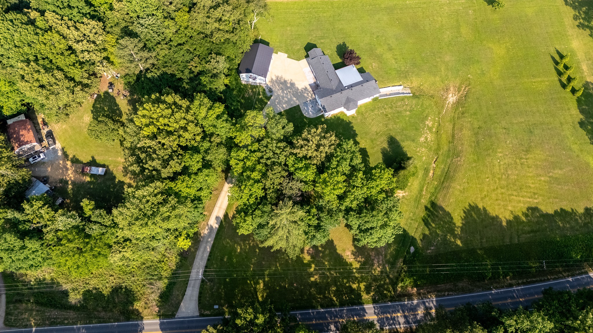 876 West Point Road Lawrenceburg, TN 38464 - Photo 2 of 42 a picture of a tree with a garden