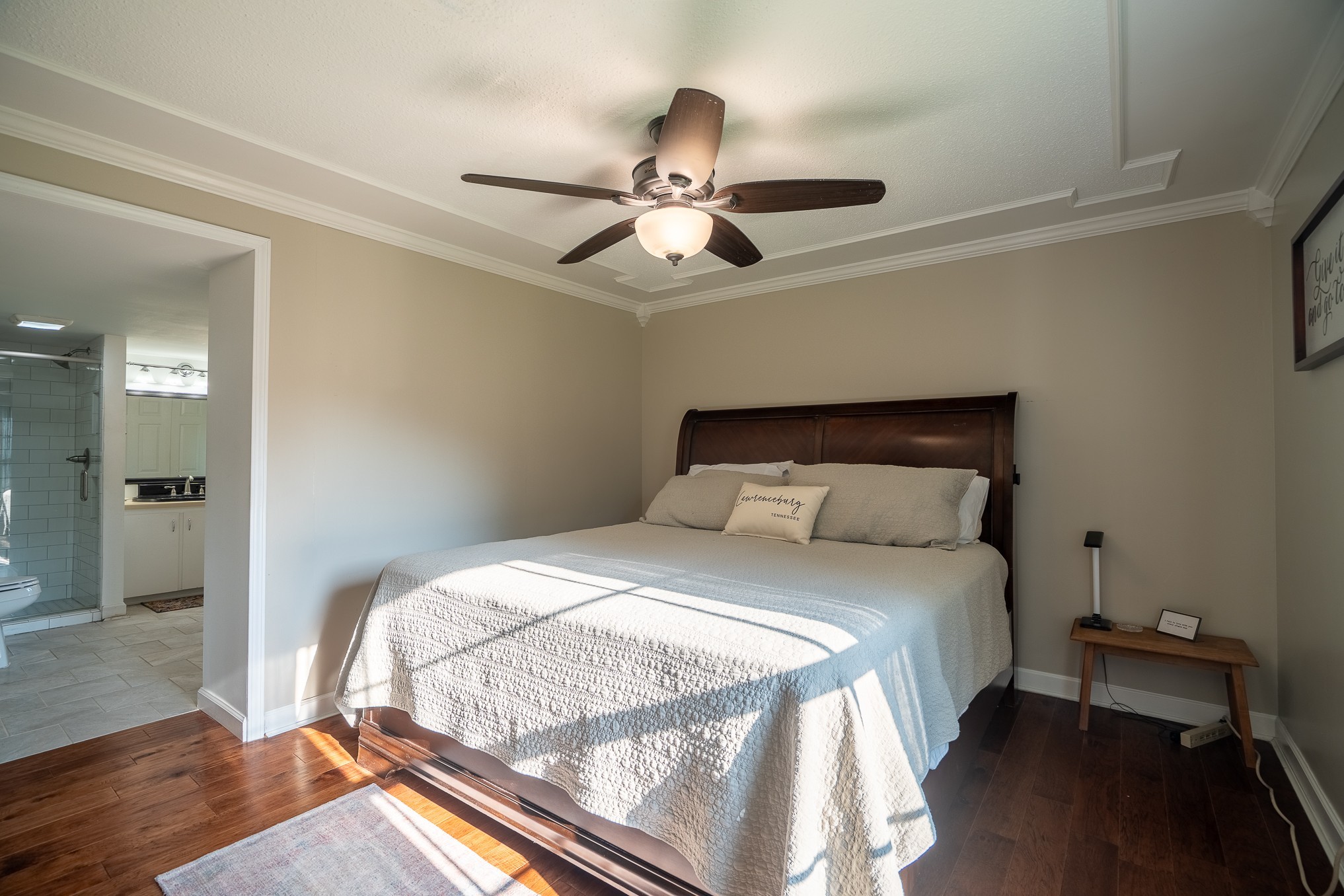 876 West Point Road Lawrenceburg, TN 38464 - Photo 22 of 42 a bedroom with a bed and a chandelier