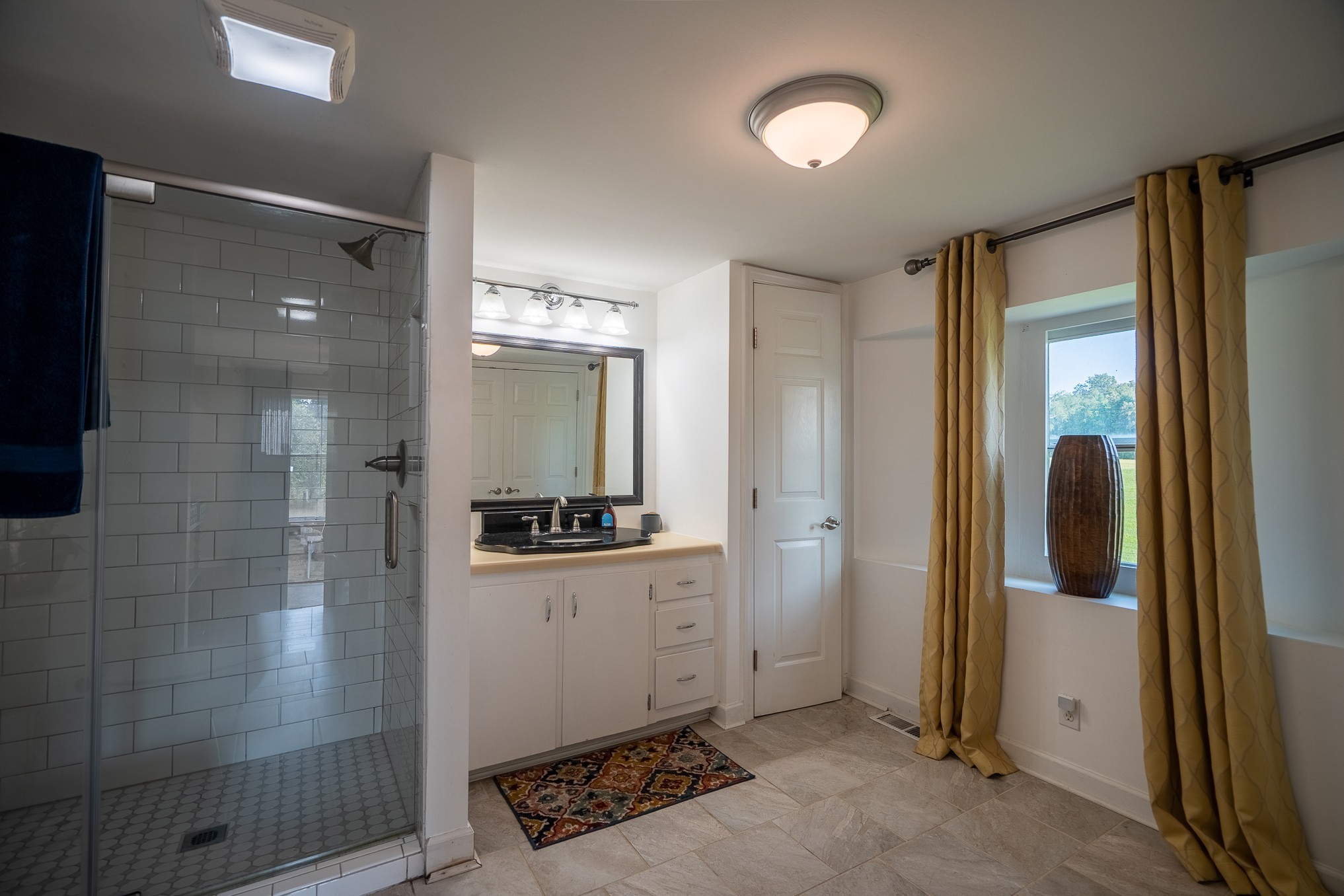 876 West Point Road Lawrenceburg, TN 38464 - Photo 23 of 42 a bathroom with a shower and a sink