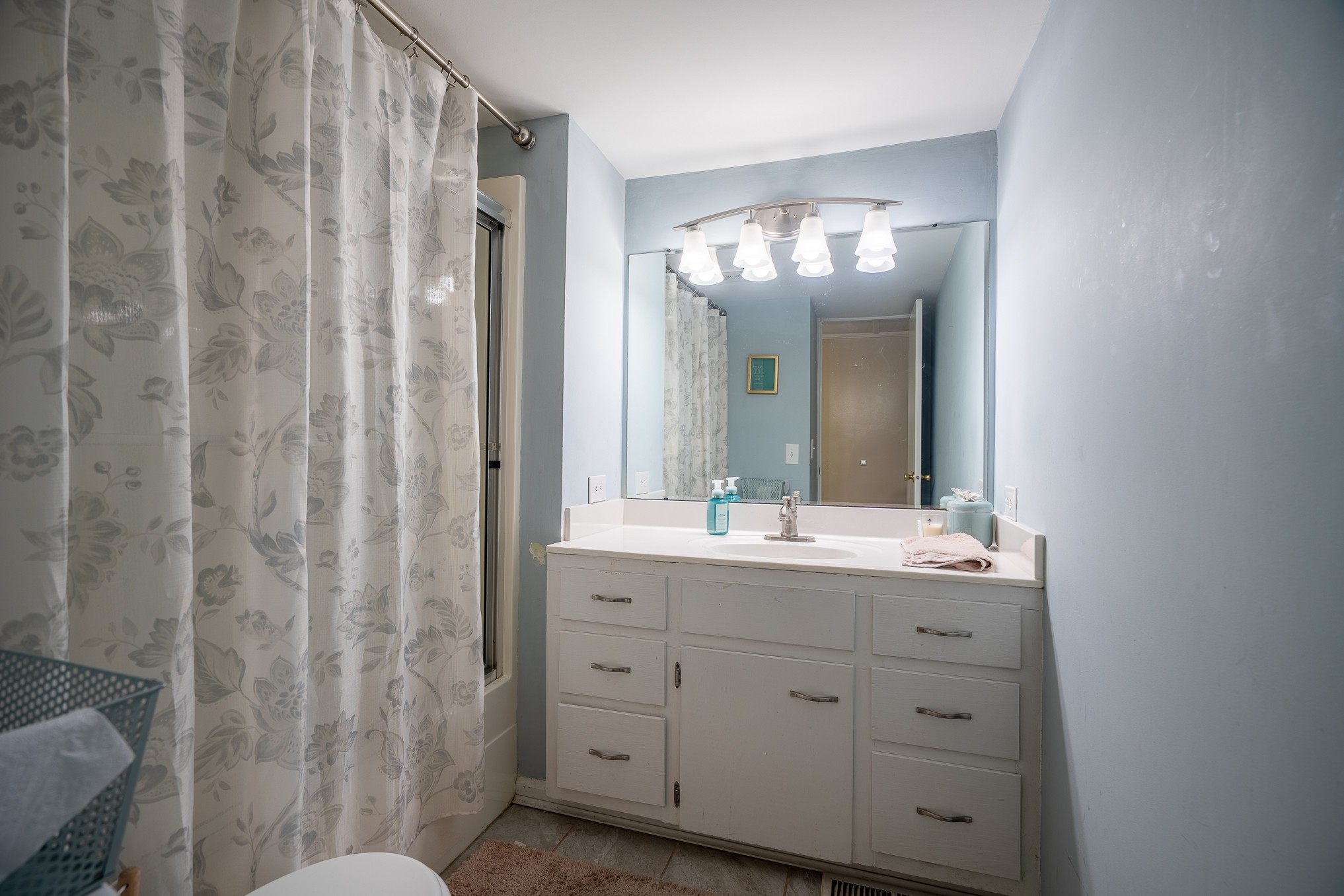 876 West Point Road Lawrenceburg, TN 38464 - Photo 28 of 42 a bathroom with a double vanity sink and mirror