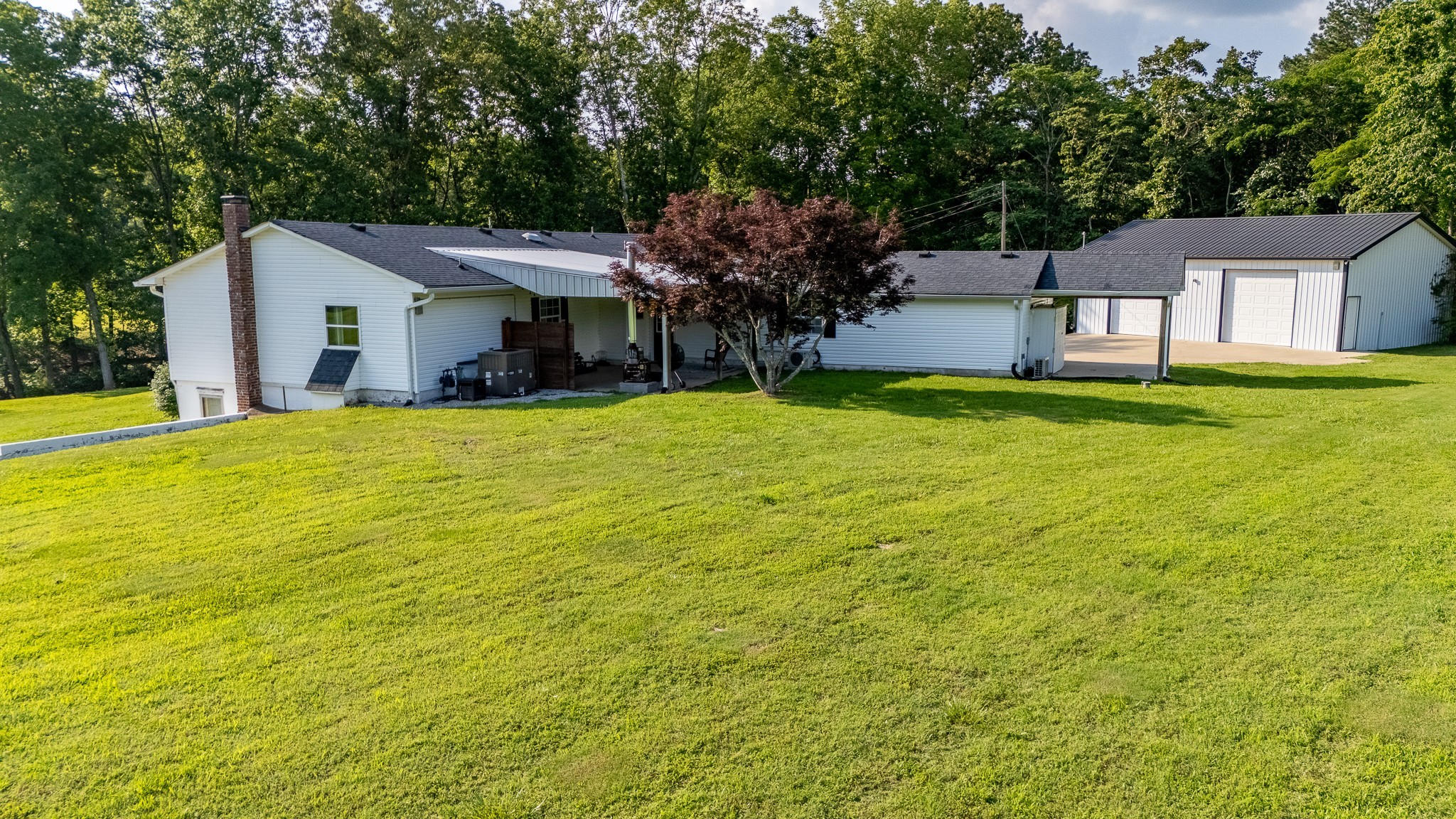 876 West Point Road Lawrenceburg, TN 38464 - Photo 38 of 42 a view of a house with a backyard