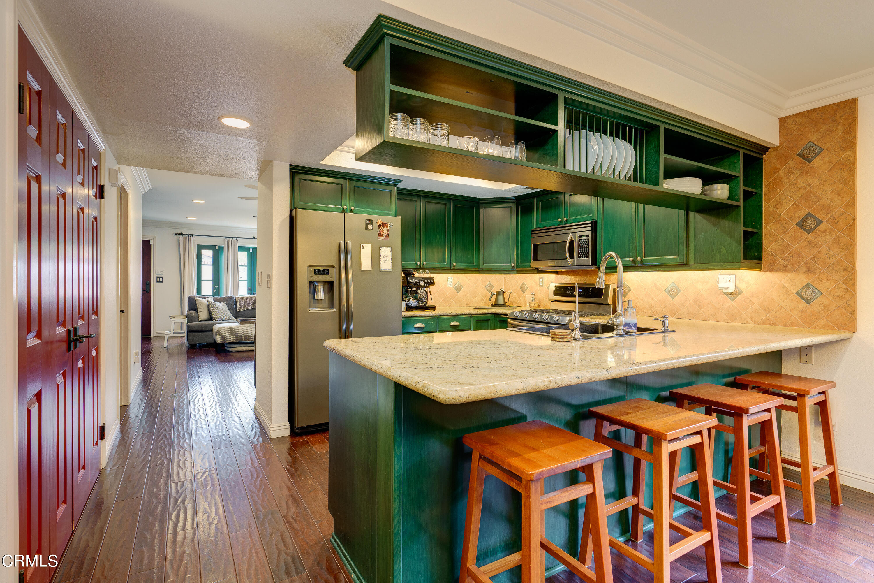 1102 Calle Adra Duarte, CA 91010 - Photo 11 of 30 a kitchen with stainless steel appliances granite countertop a kitchen island wooden cabinets and granite counter tops