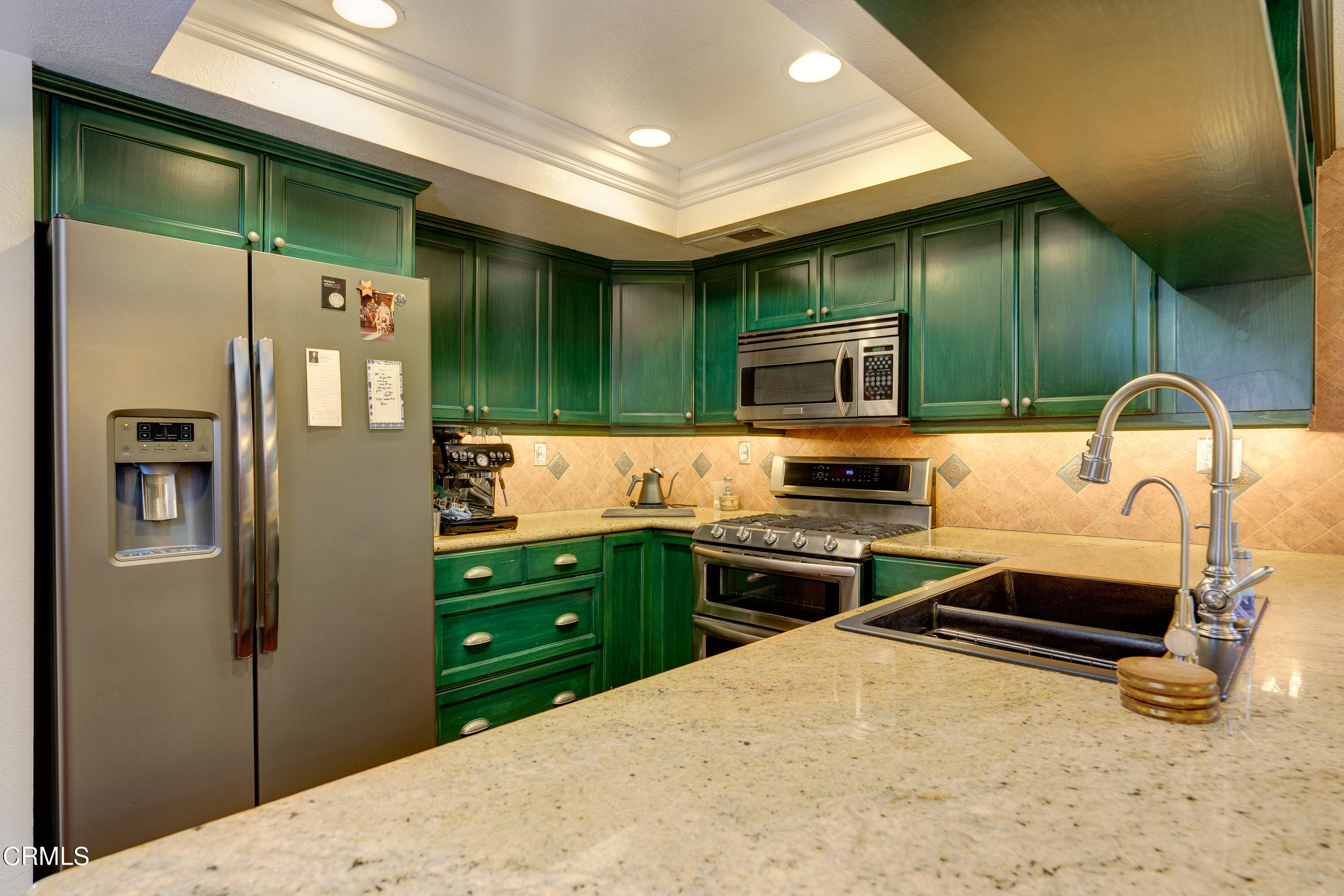1102 Calle Adra Duarte, CA 91010 - Photo 13 of 30 a kitchen with stainless steel appliances granite countertop a refrigerator and a stove top oven