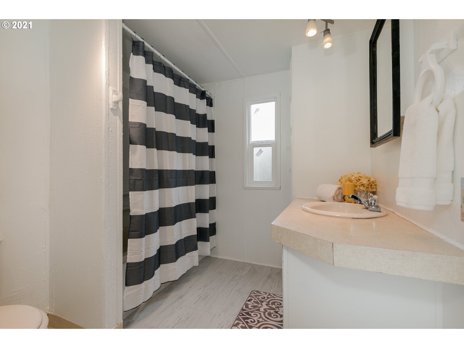 7080 Thurston Road, Unit SP 12 Springfield, OR 97478 - Photo 17 of 22 a kitchen with a sink and a refrigerator