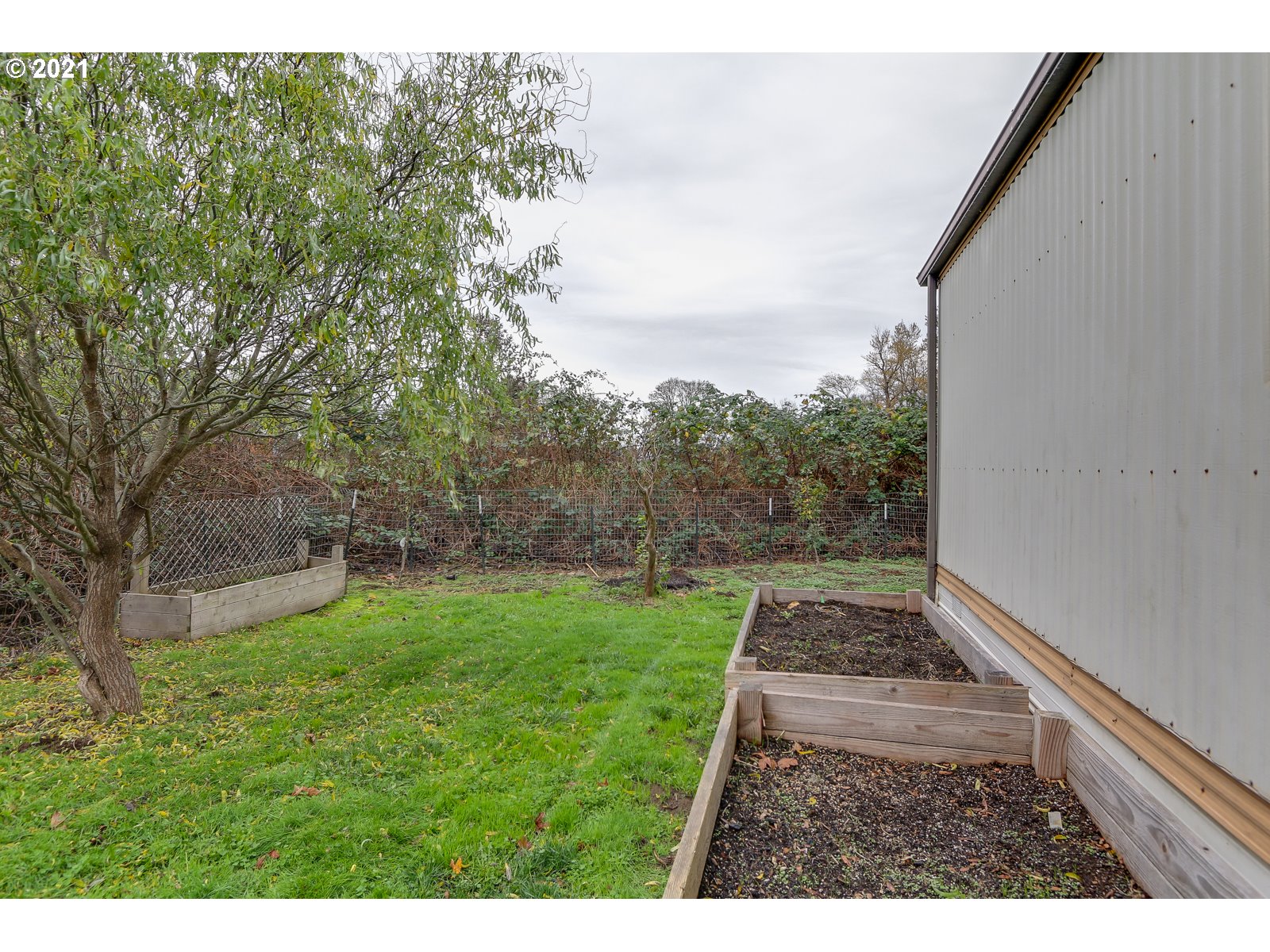 7080 Thurston Road, Unit SP 12 Springfield, OR 97478 - Photo 20 of 22 a view of a backyard with pathway