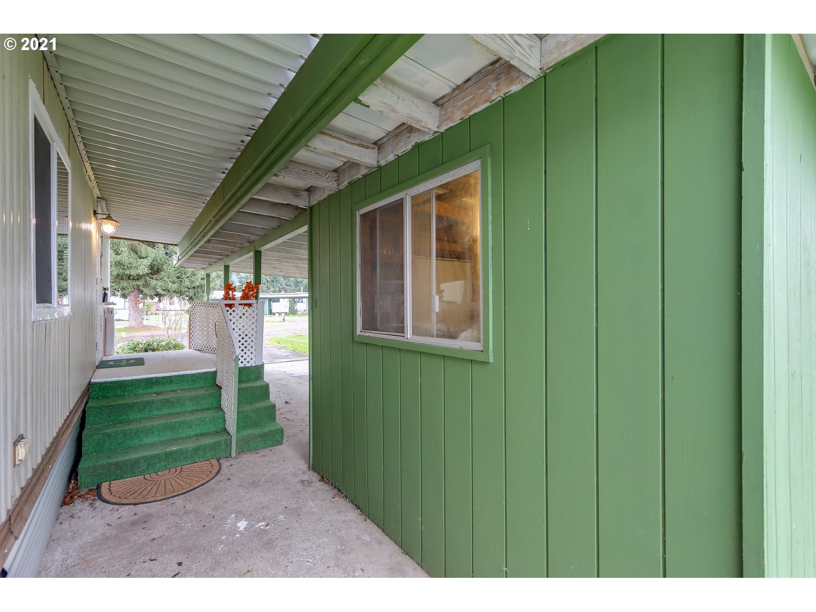 7080 Thurston Road, Unit SP 12 Springfield, OR 97478 - Photo 4 of 22 a view of a backyard with potted plants