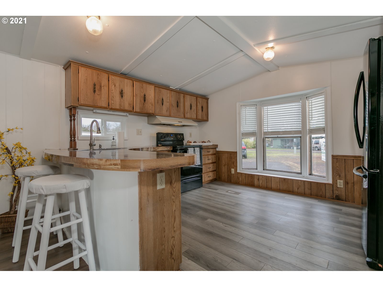 7080 Thurston Road, Unit SP 12 Springfield, OR 97478 - Photo 9 of 22 a kitchen with stainless steel appliances granite countertop a stove refrigerator sink and cabinets