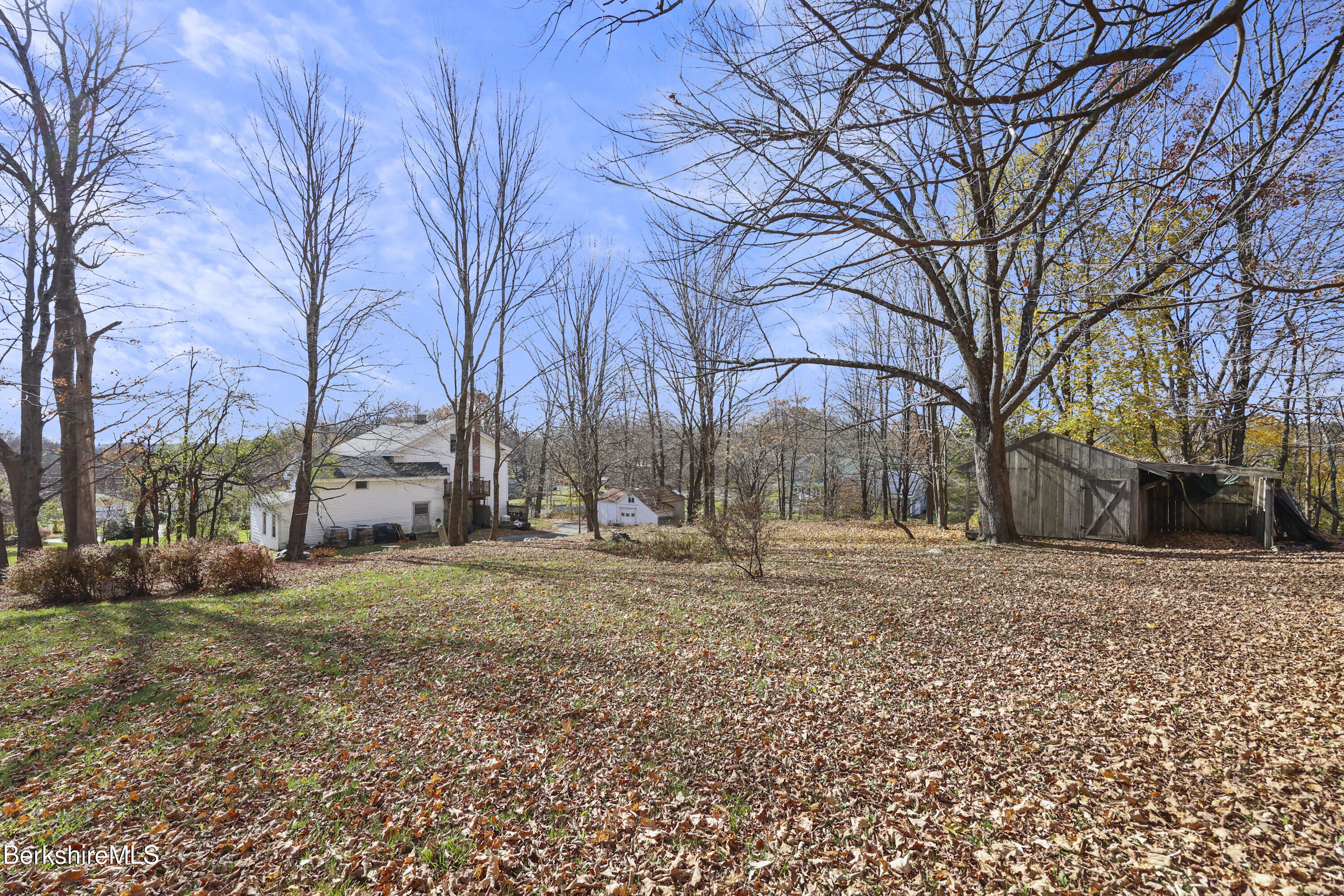 469 Maple Street Hinsdale, MA 01235 - Photo 14 of 14 a backyard of a house with trees