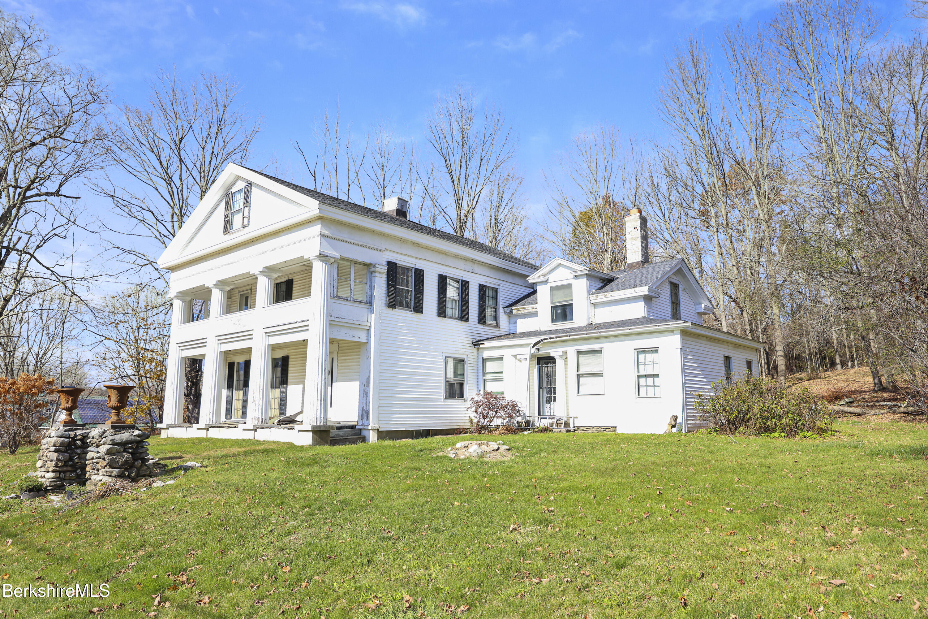 469 Maple Street Hinsdale, MA 01235 - Photo 2 of 14 a front view of a house with a garden