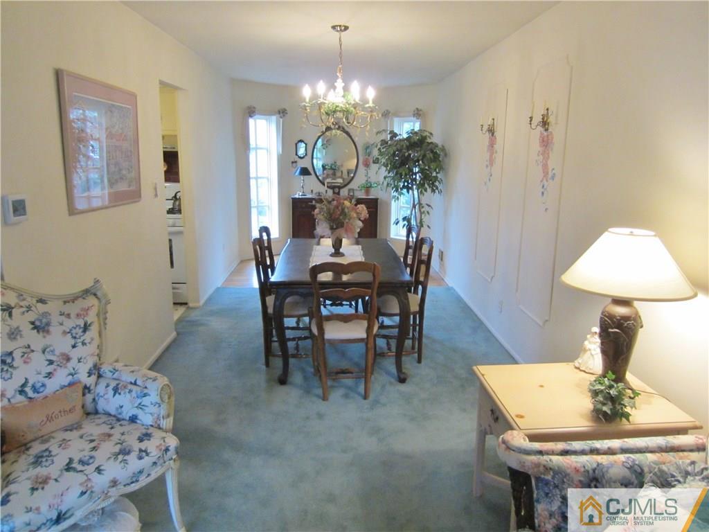 35 Monaghan Road Edison, NJ 08817 - Photo 8 of 25 a view of a dining room with furniture and chandelier