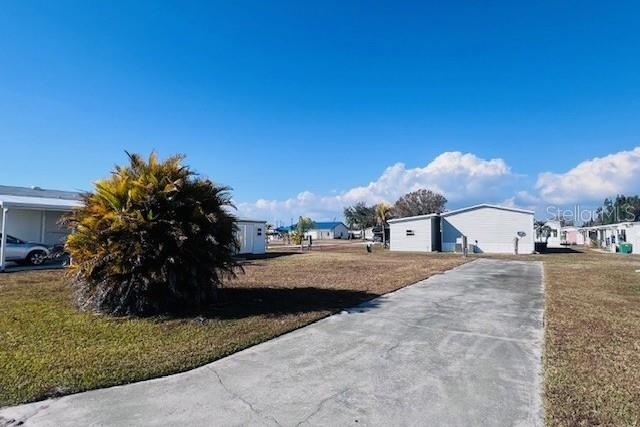 161 Tarpon Punta Gorda, FL 33950 - Photo 4 of 14 a front view of a house with a yard