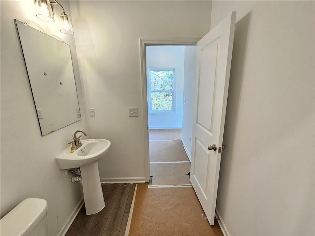 120 Silverleaf Trail Bethlehem, GA 30620 - Photo 11 of 45 a bathroom with a sink a mirror and a shower