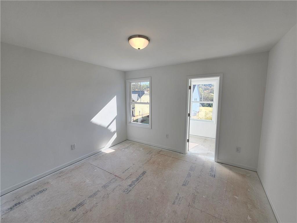 120 Silverleaf Trail Bethlehem, GA 30620 - Photo 24 of 45 an empty room with windows and closet