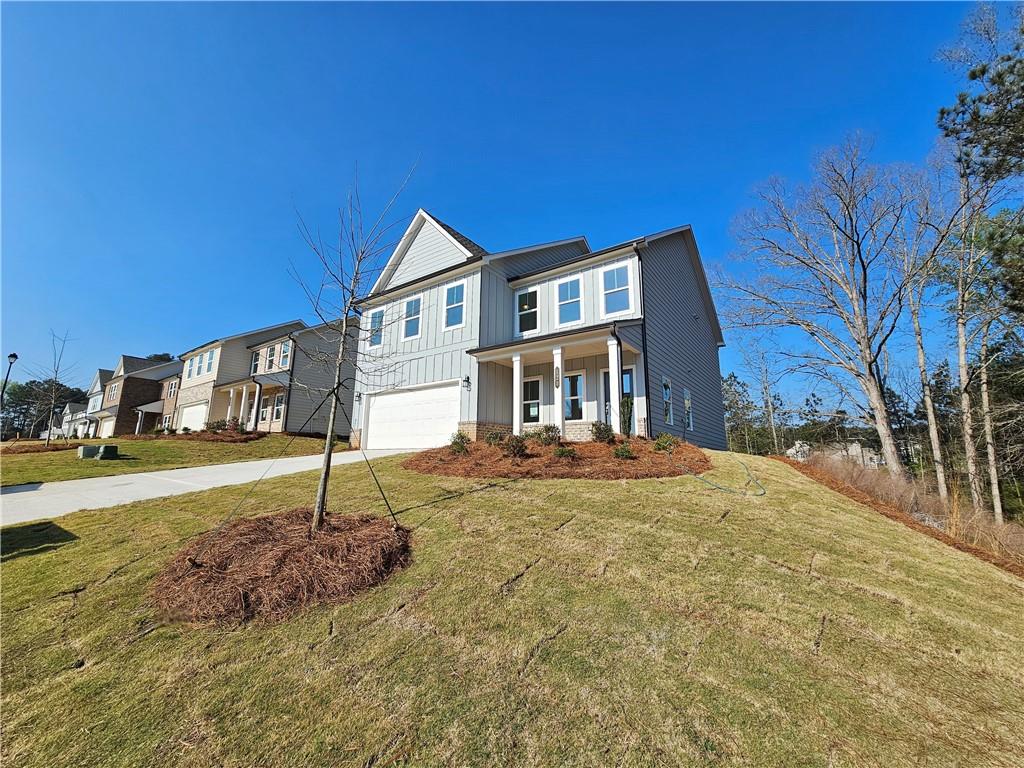 120 Silverleaf Trail Bethlehem, GA 30620 - Photo 4 of 45 a front view of a house with a yard