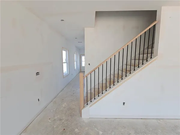 a view of a hallway with stairs