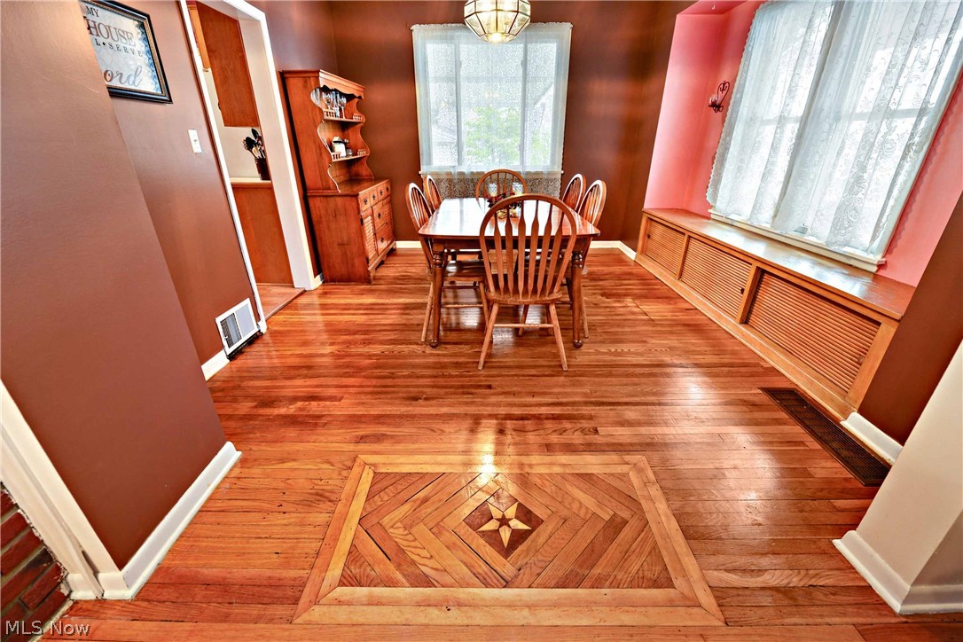 7914 Jameson Road Parma, OH 44129 - Photo 17 of 35 Wow! Look at these hard wood floors! Large dining room with window storage seat! Stunning!