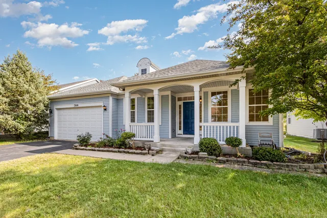 front view of a house with a yard