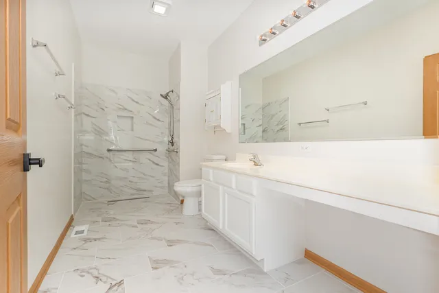 a bathroom with a bathtub sink and toilet