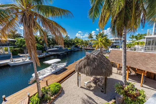 a view of a swimming pool with a table and chairs