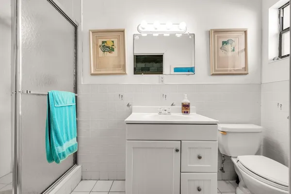 a view of a lake with couches chairs