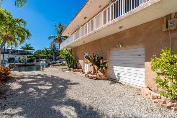 a view of a chair and table in the backyard