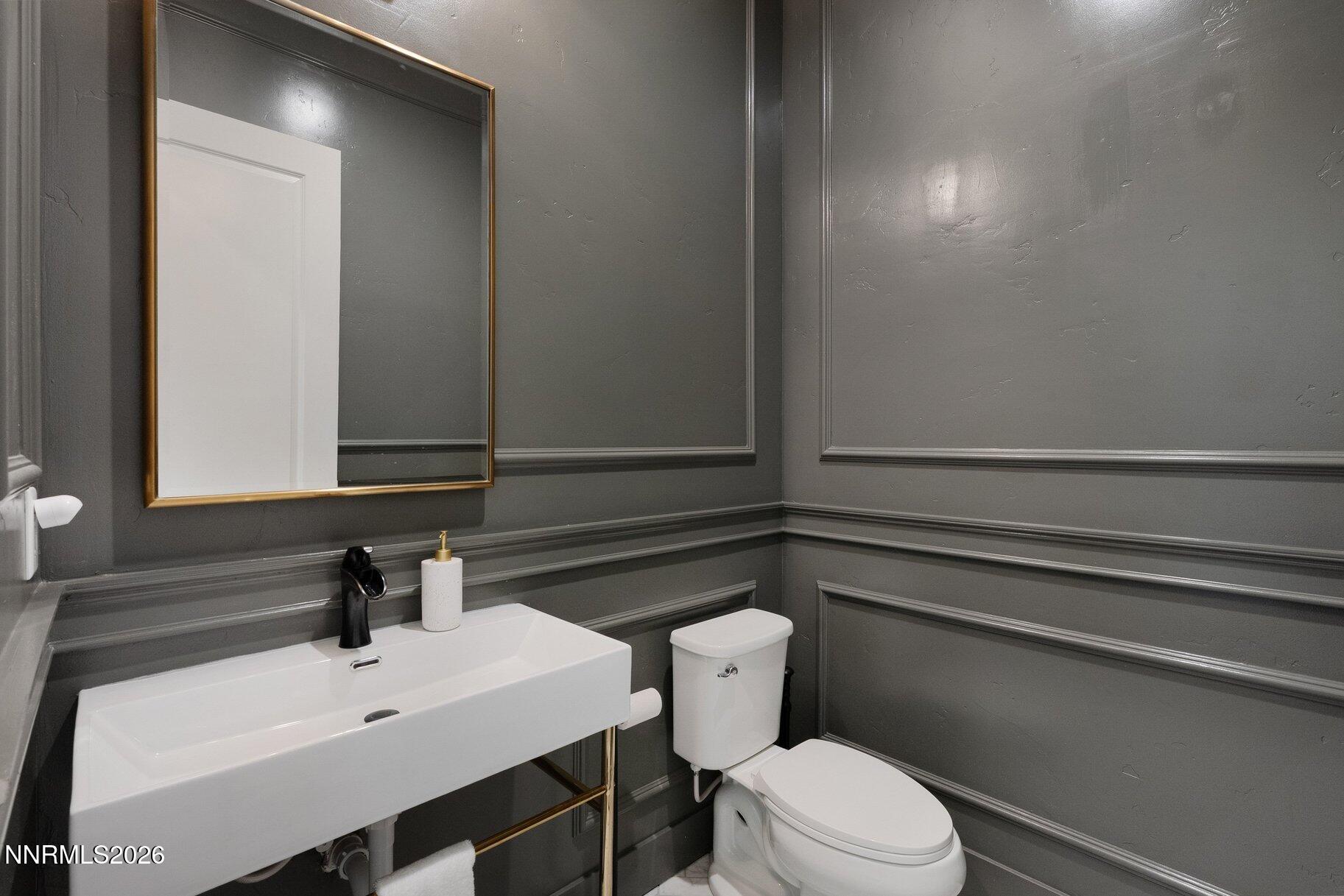 6110 South Pleasant Oak Trail Reno, NV 89511 - Photo 18 of 66 a bathroom with a sink a toilet and mirror