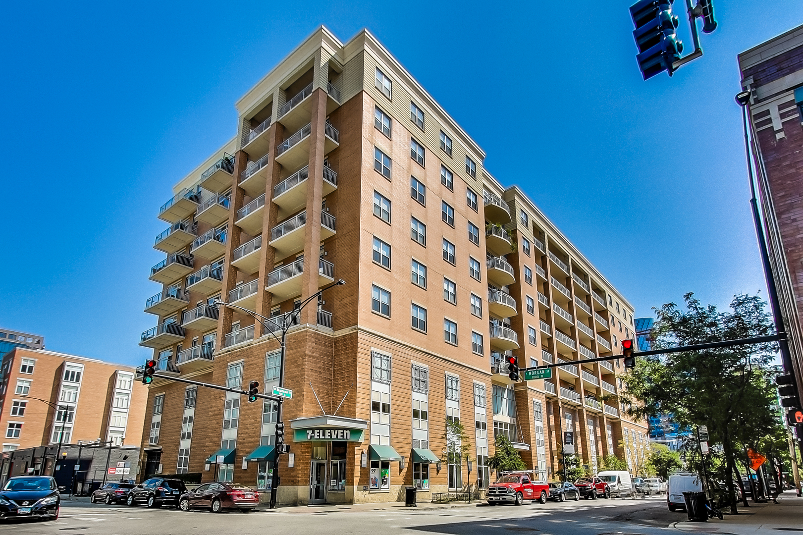 950 West Monroe Street, Unit 903 Chicago, IL 60607 - Photo 1 of 27 a view of a tall building next to a road