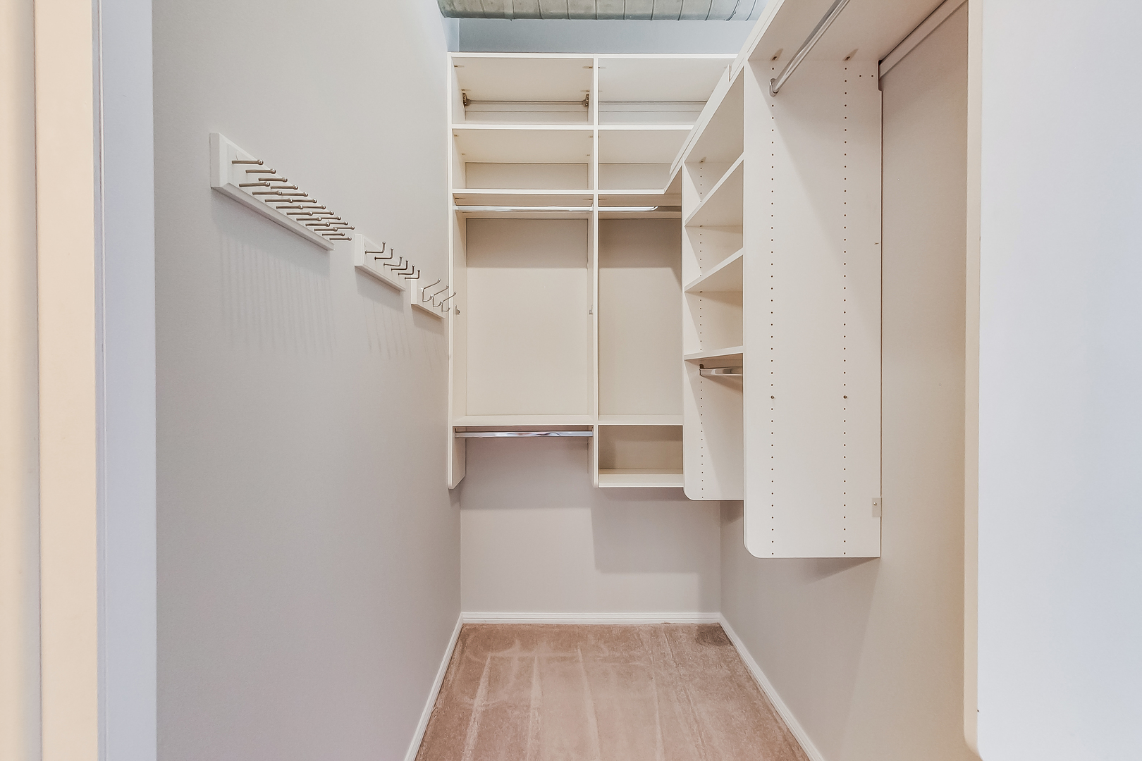 950 West Monroe Street, Unit 903 Chicago, IL 60607 - Photo 11 of 27 a view of walk in closet with empty racks