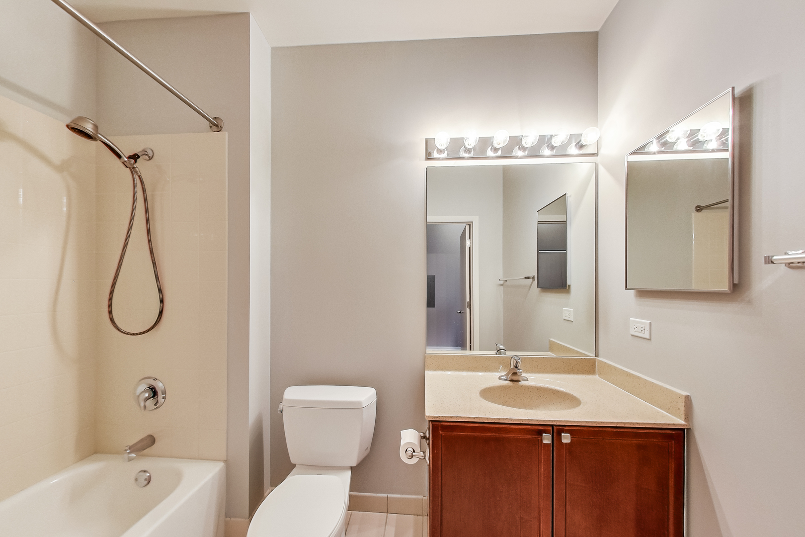 950 West Monroe Street, Unit 903 Chicago, IL 60607 - Photo 18 of 27 a bathroom with a sink and mirror with toilet