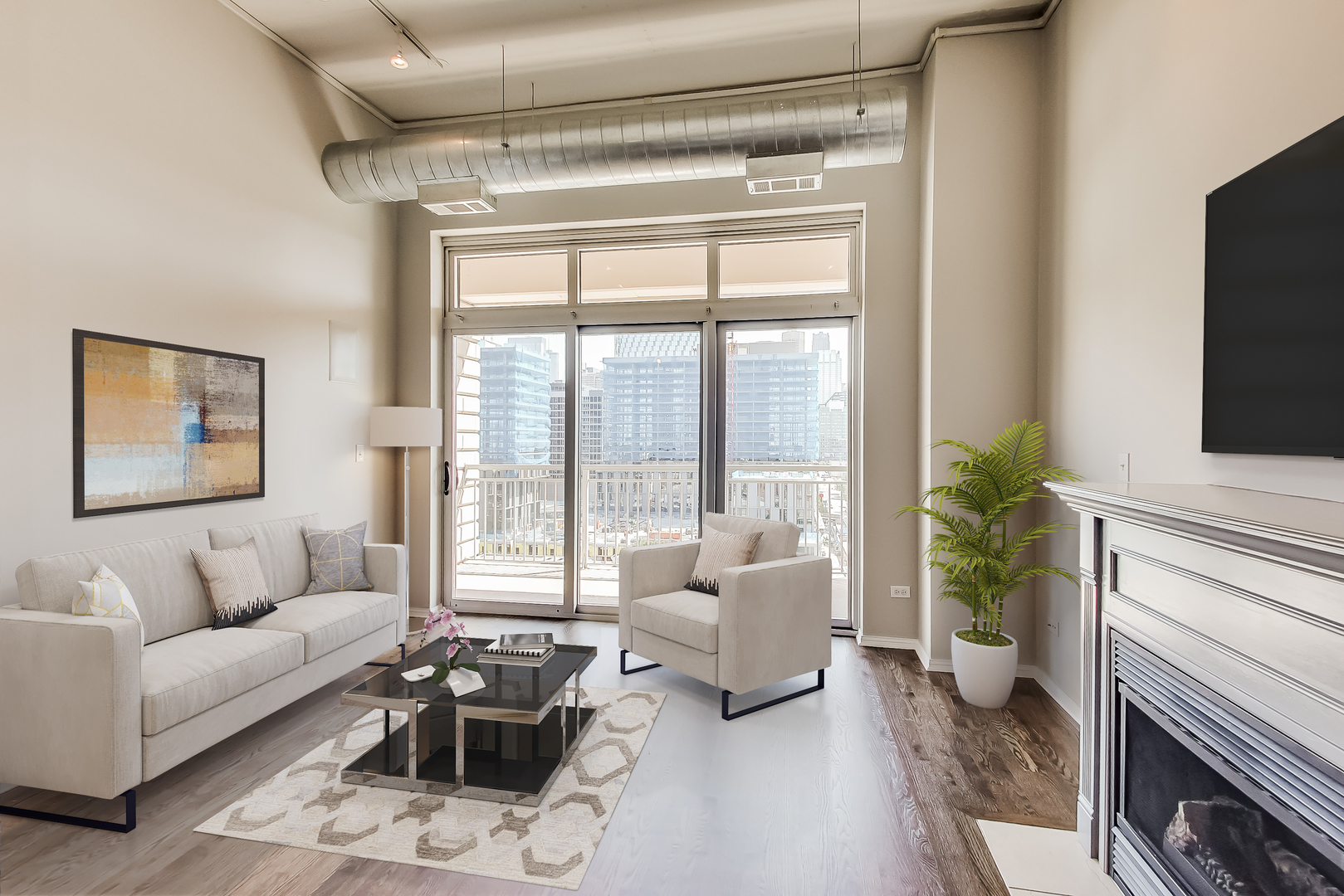 950 West Monroe Street, Unit 903 Chicago, IL 60607 - Photo 6 of 27 a living room with furniture a flat screen tv and a fireplace