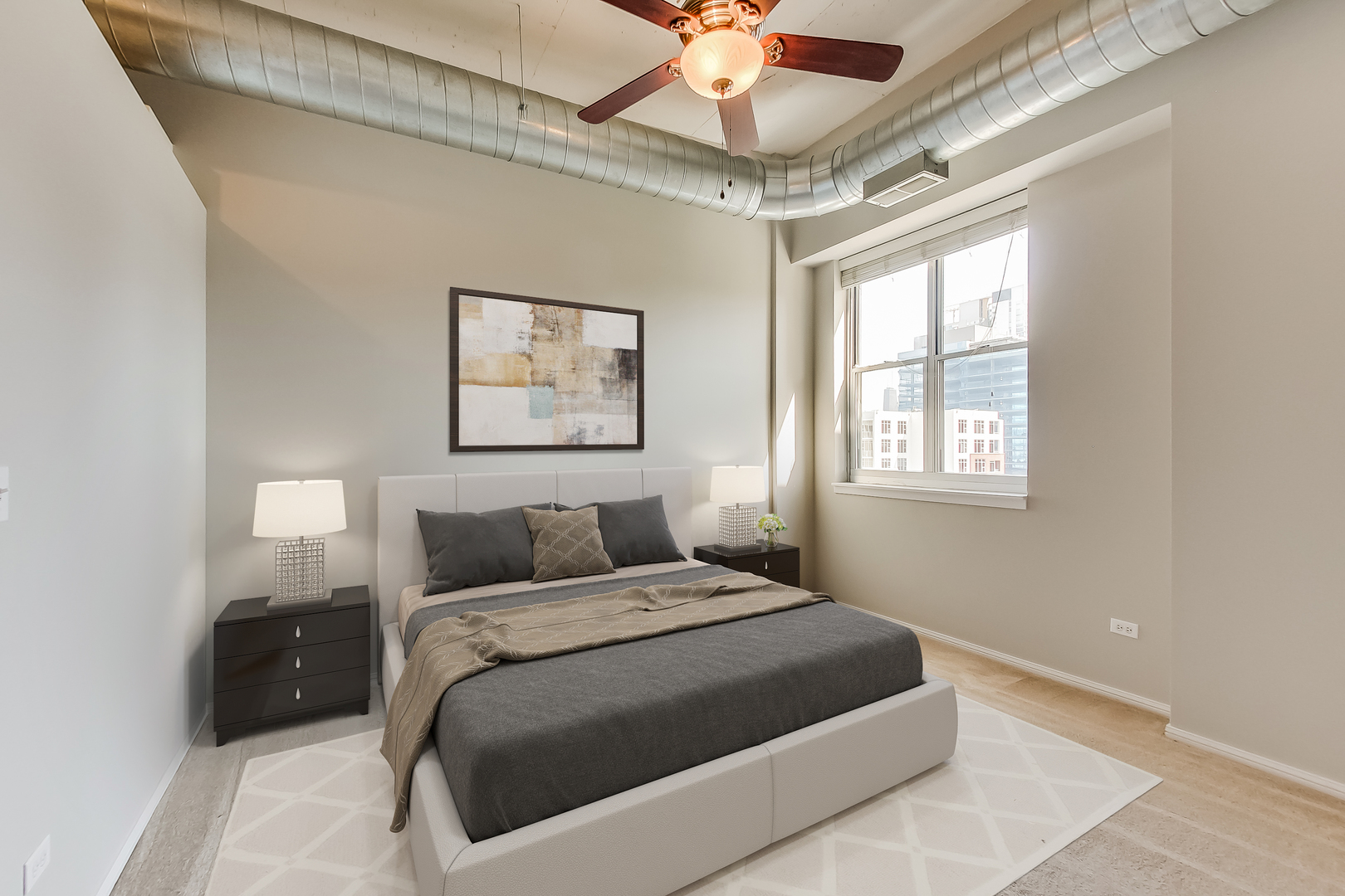 950 West Monroe Street, Unit 903 Chicago, IL 60607 - Photo 9 of 27 a bedroom with a large bed and a window