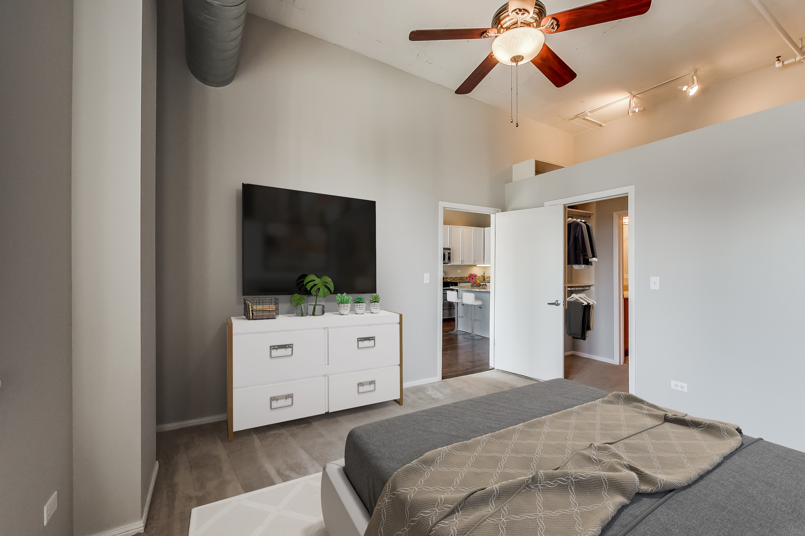 950 West Monroe Street, Unit 903 Chicago, IL 60607 - Photo 10 of 27 a bedroom with a bed and a flat screen tv