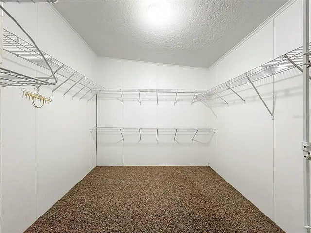 a bathroom with a granite countertop sink mirror vanity and toilet