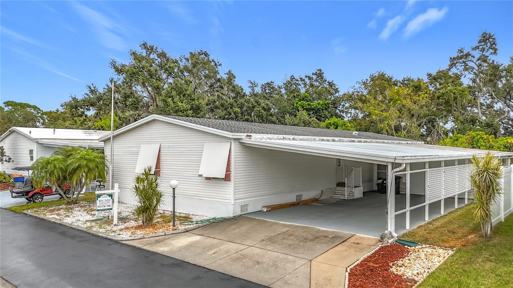 8307 Nancy Lane Ellenton, FL 34222 - Photo 2 of 56 a view of a house with backyard and sitting area