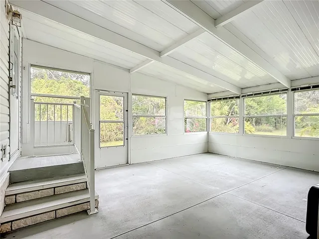 a view of walk in closet with window and refrigerator