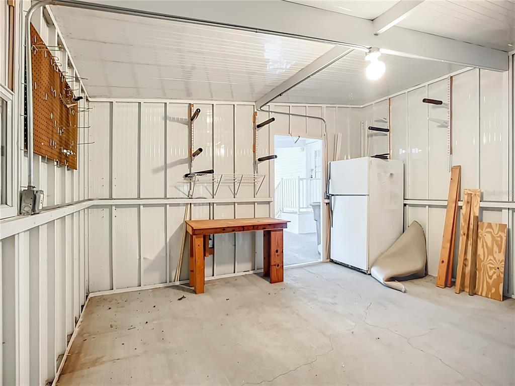 8307 Nancy Lane Ellenton, FL 34222 - Photo 30 of 56 a view of walk in closet with window and refrigerator