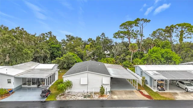 a view of a sign that is sitting in the grass