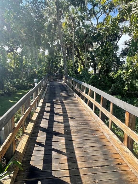 8307 Nancy Lane Ellenton, FL 34222 - Photo 37 of 56 a view of a balcony with wooden floor and fence
