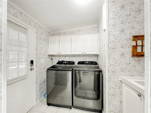 a stove top oven sitting inside of a kitchen