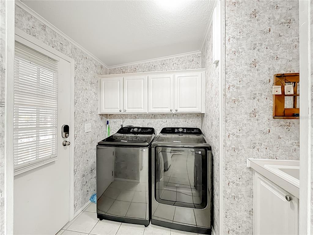 8307 Nancy Lane Ellenton, FL 34222 - Photo 9 of 56 a stove top oven sitting inside of a kitchen