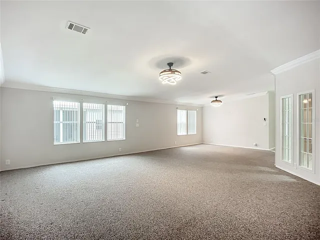 a view of empty room with windows